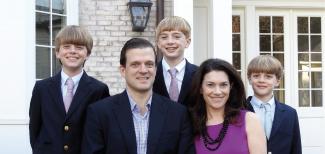 Christopher Swann, G’98, WG’98, and Natasha Harvey Swann, C’92, WG’98, with their children