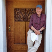 Paul Hendrickson leaning against a door